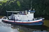 NH3 Kraken seiler utslippsfritt på en sideelv til Hudson River i New York. Den 67 år gamle taubåten har installert en Amogy-cracker som omdanner NH3 til nitrogen og hydrogen samt brenselcelle som benytter H2 i prosessen.