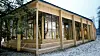 Lund Hagem arkitekter og Atelier Oslo har valgt en beskjeden plassering av Klimahuset ved siden av Brøggers Hus, tidligere Geologisk museum i Botanisk hage i Oslo.