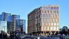 Valle Wood ligger i hjertet av den nye Hovinbyen på Oslo øst. Arkitekten Lund og Slaatto beskriver trebygget som en «varmelampe» for omgivelsene. Til høyre for bygget kommer det høyere bygninger i glass, stål og betong.