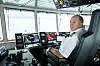 Kaptein Ottar Vattøy på brua til fergen MF Hadarøy, designet og utstyrt av Hav Group.