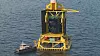 Oppdrettsanlegget i foten av vindmøllen skal kunne drives autonomt. Illustrasjon: Heerema