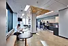 Interior photography of staff in a modern office breakout area with kitchen, a lunc ...