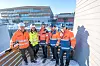 Stort prosjekt: I august i år skal nye Heimdal videregående være ferdig. Fra venstre mot høyre: Torger Mjønes, Marit Sollien, Jarle B. Refseth, Eskil Solberg og Stein Jakobsen. I bakgrunnen ses den nye skolen som ligger vegg i vegg med svømmehallen som skal få energi fra det nye biogassanlegget. Bilde: Havard Zeiner