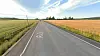 Flatbygdene langs riksvei 2 i Grue i Solør, med utsyn nordover. To-tre hundre meter til venstre renner Glomma i motsatt retning.