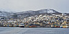 Harstad fra sjøsiden med hurtigruta ved kai.