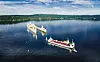 Asko Maritimes to sjødroner ble transportert fra India på tungløftskipet «Yacht Servant». Det fyller ballasttanker og senkes ned slik at fartøyene kan bukseres ut med taubåter.