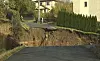 A still image taken from Reuters video shows a crater that appeared in the early hours in the central German town of Schmalkalden, November 1, 2010. A huge crater measuring 30 by 40 metres has opened up in the middle of a residential estate, according to local police. REUTERS/Reuters TV (GERMANY - Tags: DISASTER SOCIETY) Schmalkalden
