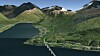 Modell av brua og ny E8. Skredforbygningene kommer oppe i fjellet nesten innerst i fjorden.