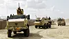 En Dingo II med RWS på taket, en SISU og en bergningsvogn fra taktisk transport tropp kjører ut av PRT leieren i Meymaneh, Afghanistan.