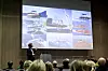 Jon Dugstad viser fram gode eksempler på norsk leverandørindustri som leverer til havvind-markedet i Europa. Flere av bildene er av flåten til Fred. Olsen Ocean. Foto: Julie Messel/Zero